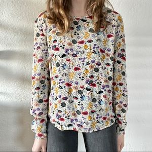 Modern Floral Blouse with Button Back & Asymmetrical Hem